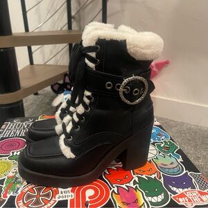 Black Karl Lagerfeld faux fur boots with silver buckle